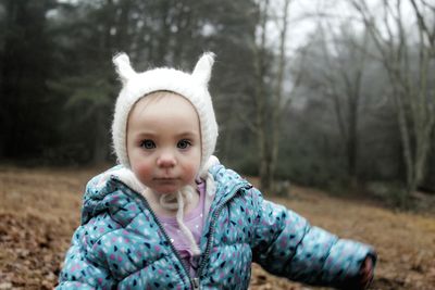 Portrait of cute girl in forest