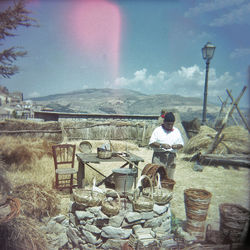 Woman standing on rock