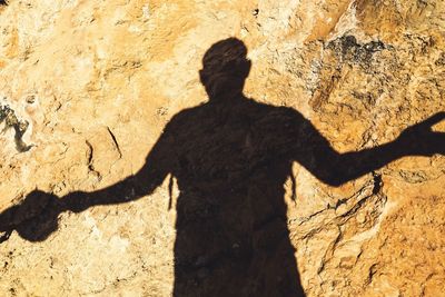 Shadow of man on rock