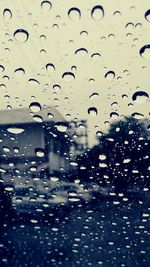 Full frame shot of raindrops on windshield