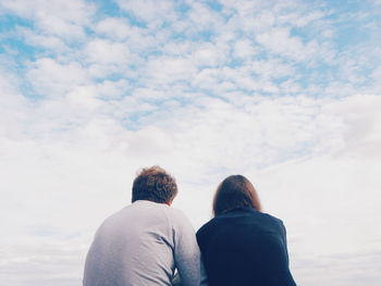 Rear view of couple against sky