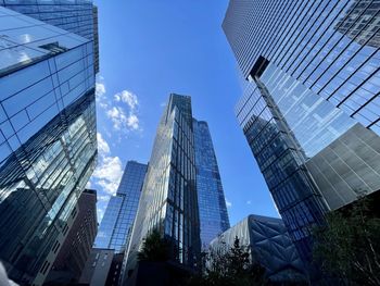 Low angle view of modern buildings against sky