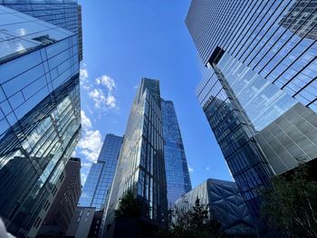 Low angle view of modern buildings against sky