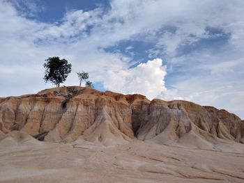 Rock formations in desert against sky