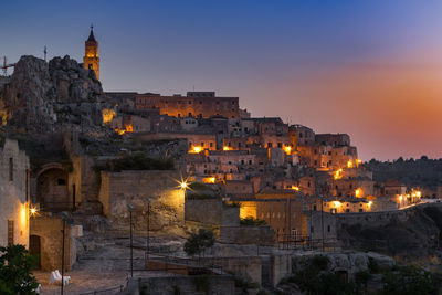 Illuminated old town of matera at dusk, basilicata region, southern italy