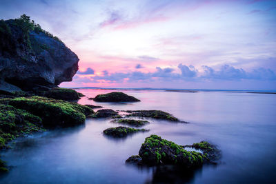 Scenic view of sea against sky at sunset