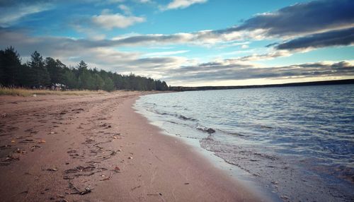 Scenic view of beach against sky