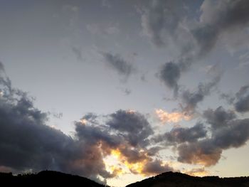 Low angle view of dramatic sky during sunset