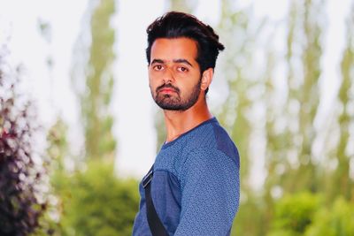 Portrait of young man looking away