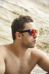 Portrait of young man wearing sunglasses