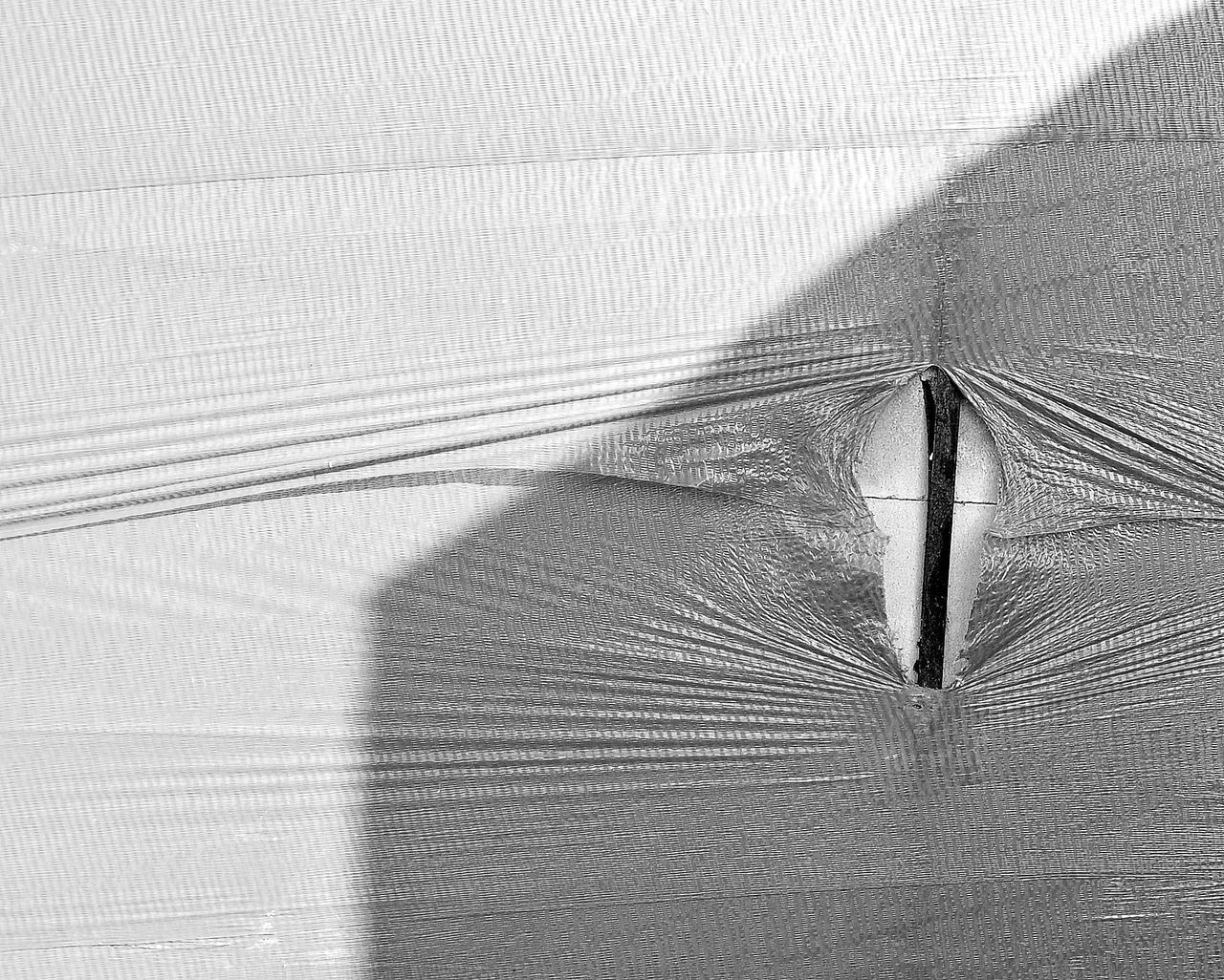 HIGH ANGLE VIEW OF FEATHER ON SHADOW