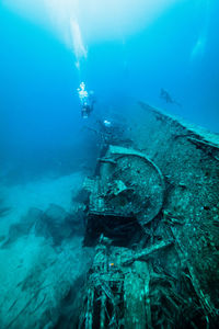 High angle view of man swimming in sea