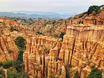 Scenic view of rock formations against sky