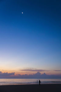 Scenic view of sea against sky at sunset