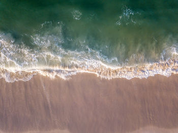 Full frame shot of waves rushing towards shore