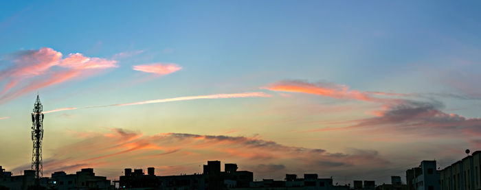 Low angle view of silhouette buildings against sky during sunset