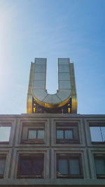 Low angle view of building against clear blue sky