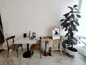 Chairs and tables against wall at home