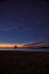 Scenic view of sea against clear sky at night