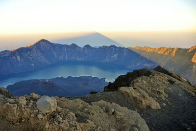 Scenic view of mountains against sky at sunset