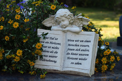 Close-up of angel statue in cemetery