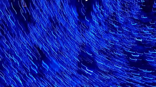 Full frame shot of illuminated star trails