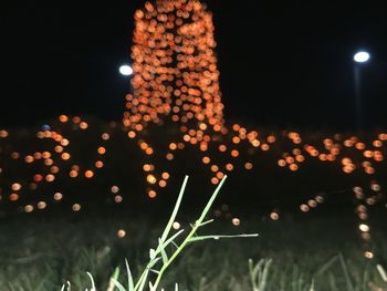 Defocused image of illuminated christmas lights at night