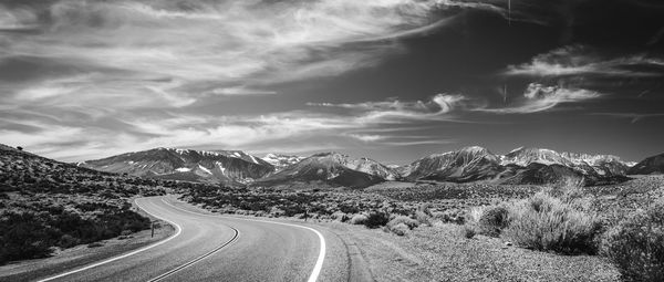 Scenic view of mountain road against sky