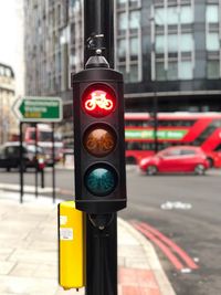 Close-up of road sign on city street