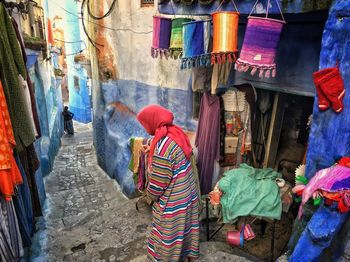 Rear view of people at market