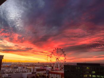 Built structure against cloudy sky at sunset