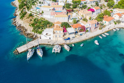 Assos picturesque fishing village from above, kefalonia, greece. aerial drone view. 