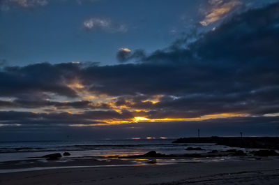 Scenic view of sea against dramatic sky