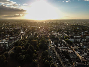 High angle view of illuminated cityscape against sky during sunset