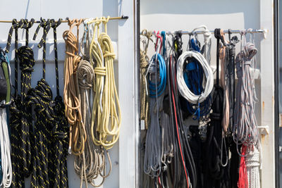 Colorful ropes hanging at harbor