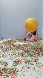 High angle view of multi colored balloons against wall