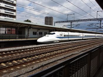 Train on railroad station platform against sky