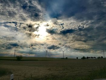 Scenic view of landscape against cloudy sky
