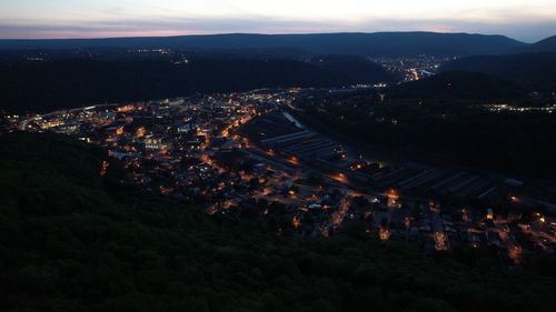 High angle view of illuminated buildings in city at night