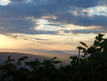 Scenic view of silhouette landscape against sky at sunset