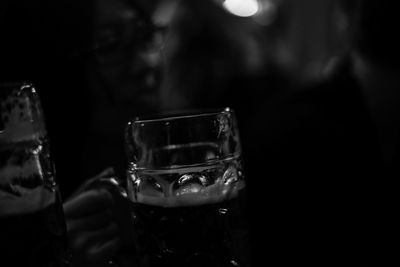 Close-up of wine glasses on table