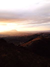 Aerial view of city at sunset