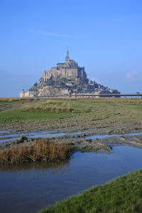 Mont saint michel normandy, bay and blue sky.