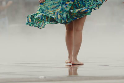 Low section of woman standing on floor