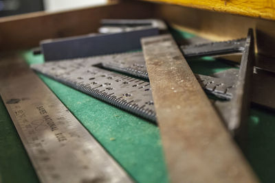 Close-up of work tool with rulers on table