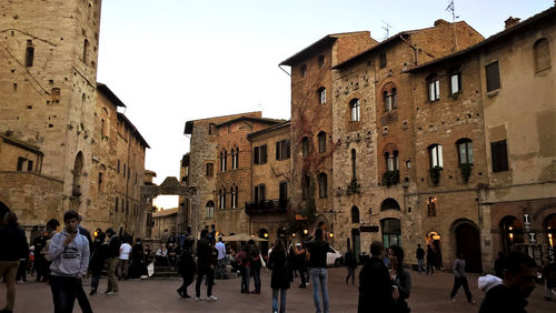 Group of people walking in old building