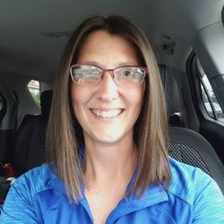 Portrait of a smiling young woman in car