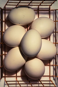 High angle view of white eggs on table