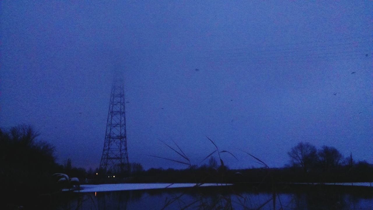 clear sky, blue, water, electricity pylon, fuel and power generation, silhouette, copy space, dusk, electricity, connection, reflection, waterfront, sky, nature, tranquility, lake, tree, outdoors, built structure, river