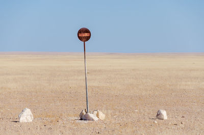 No entry sign in desert against clear sky